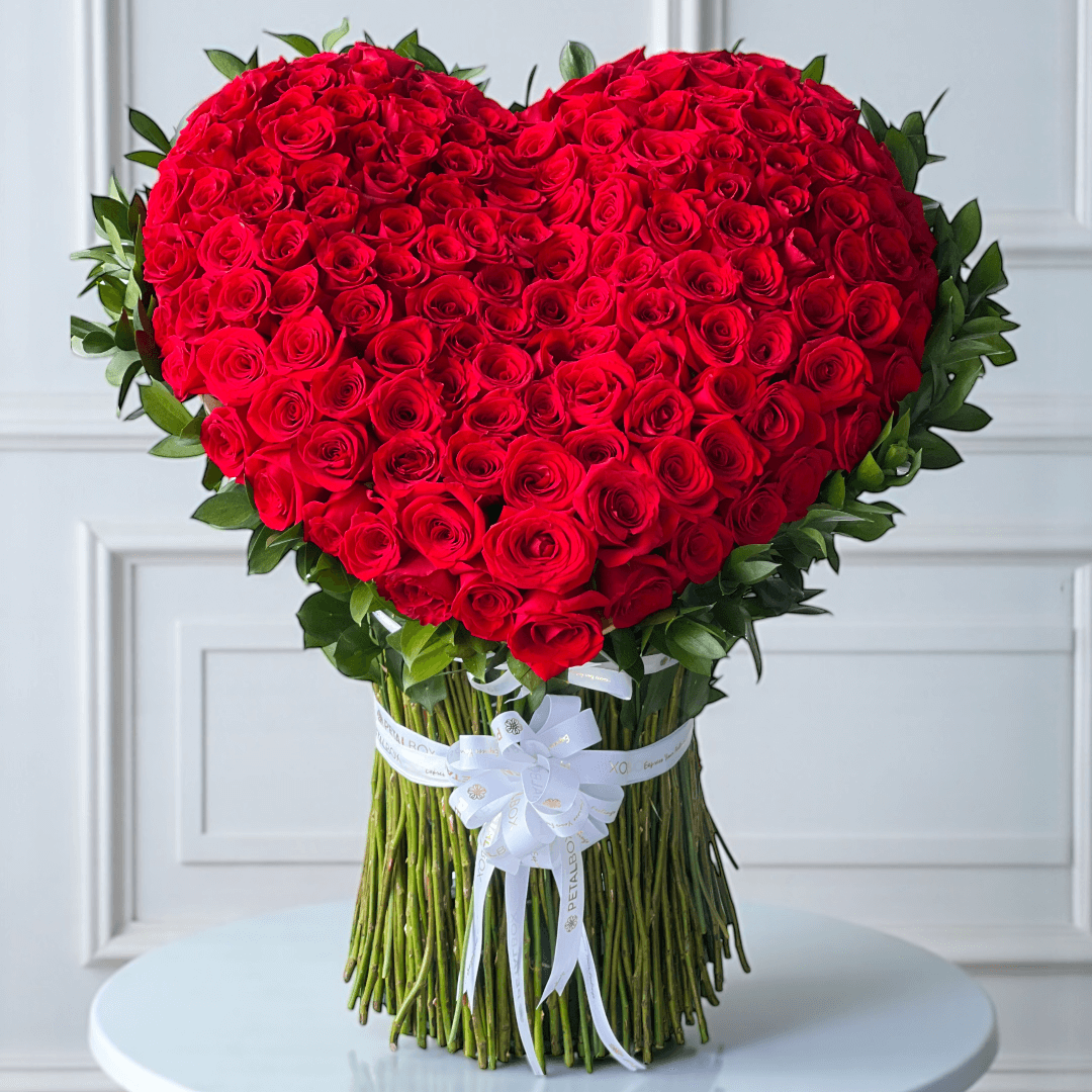 Heart shaped red rose bouquet arranged with fresh roses for romantic flower delivery in Kuwait