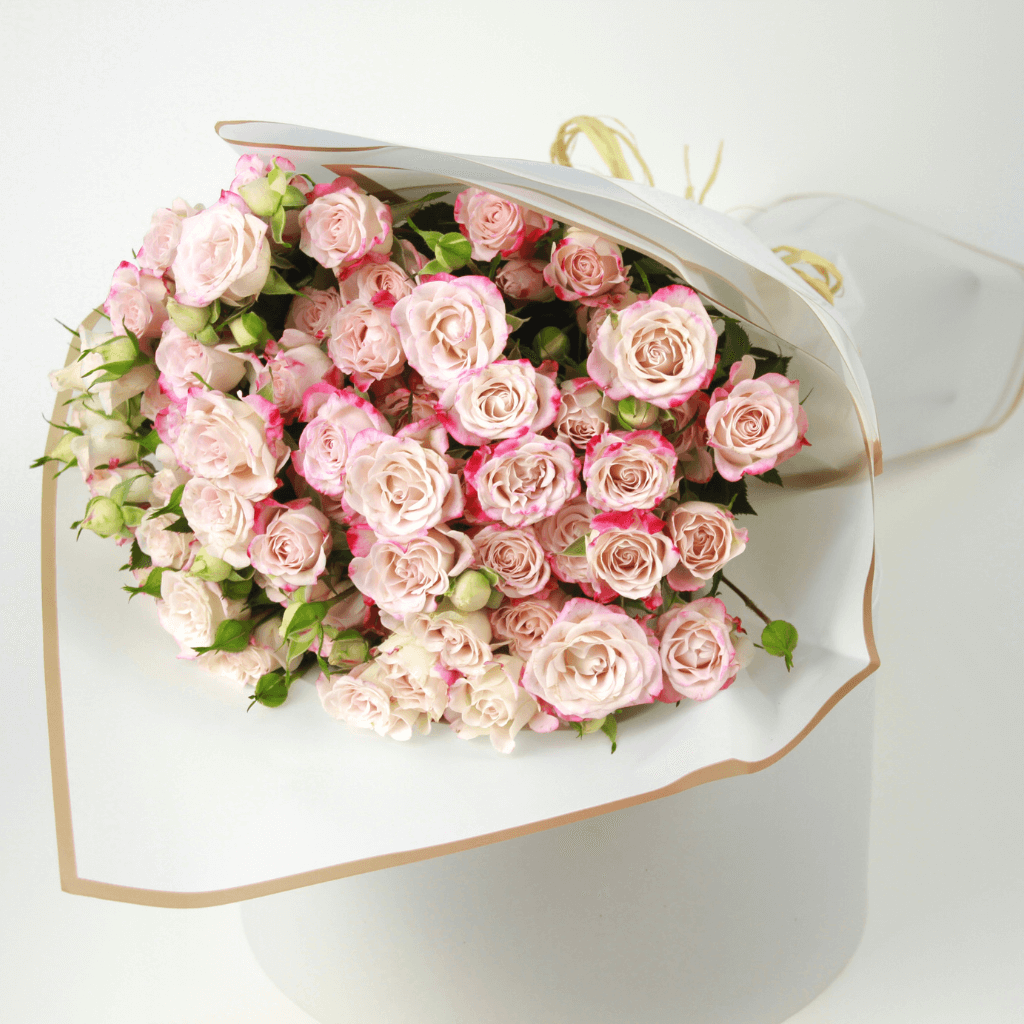 Soft blush spray rose bouquet arranged with fresh clustered blooms, perfect for thoughtful gifting and reliable flower delivery across Kuwait.