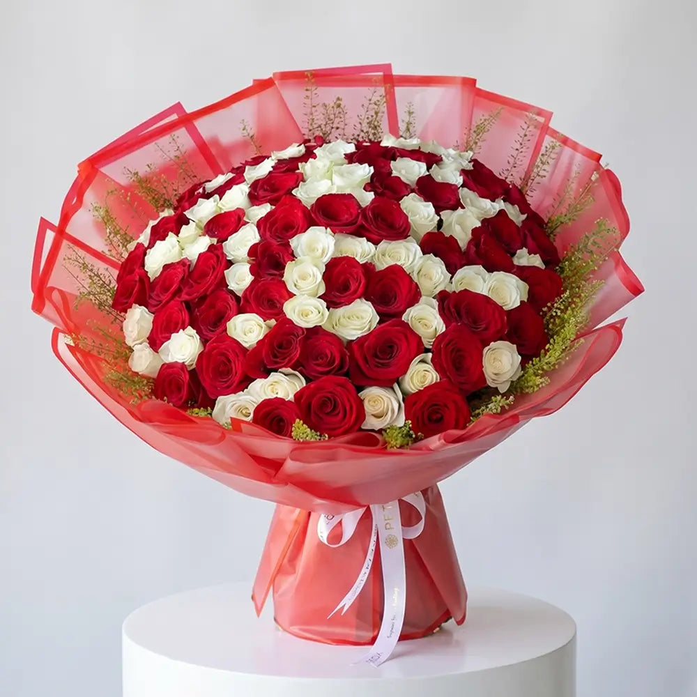Grand red and white rose bouquet with elegant wrapping for flower delivery in Kuwait