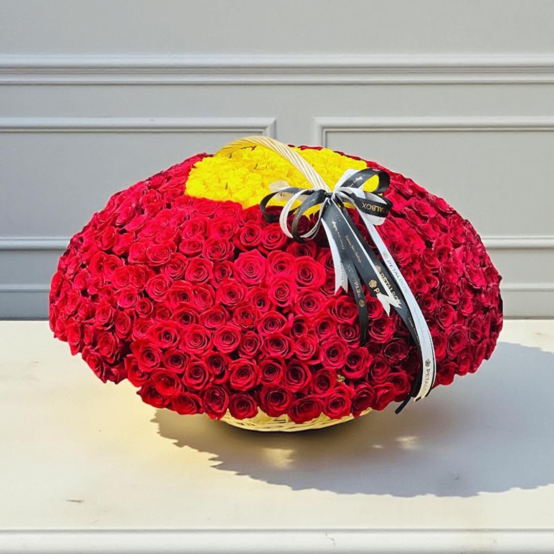 Luxury red and yellow rose basket arranged with fresh roses for flower delivery in Kuwait