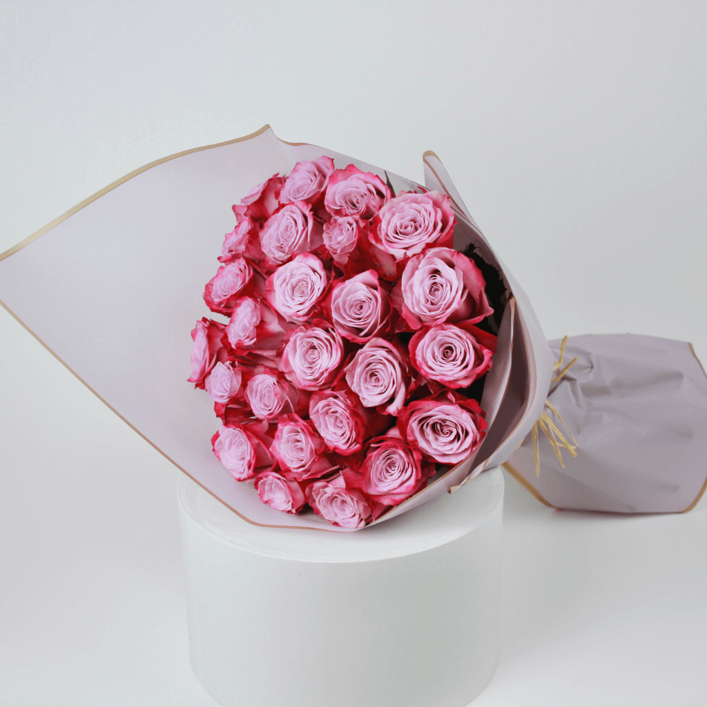 Purple rose bouquet wrapped elegantly, ideal for flower delivery in Kuwait