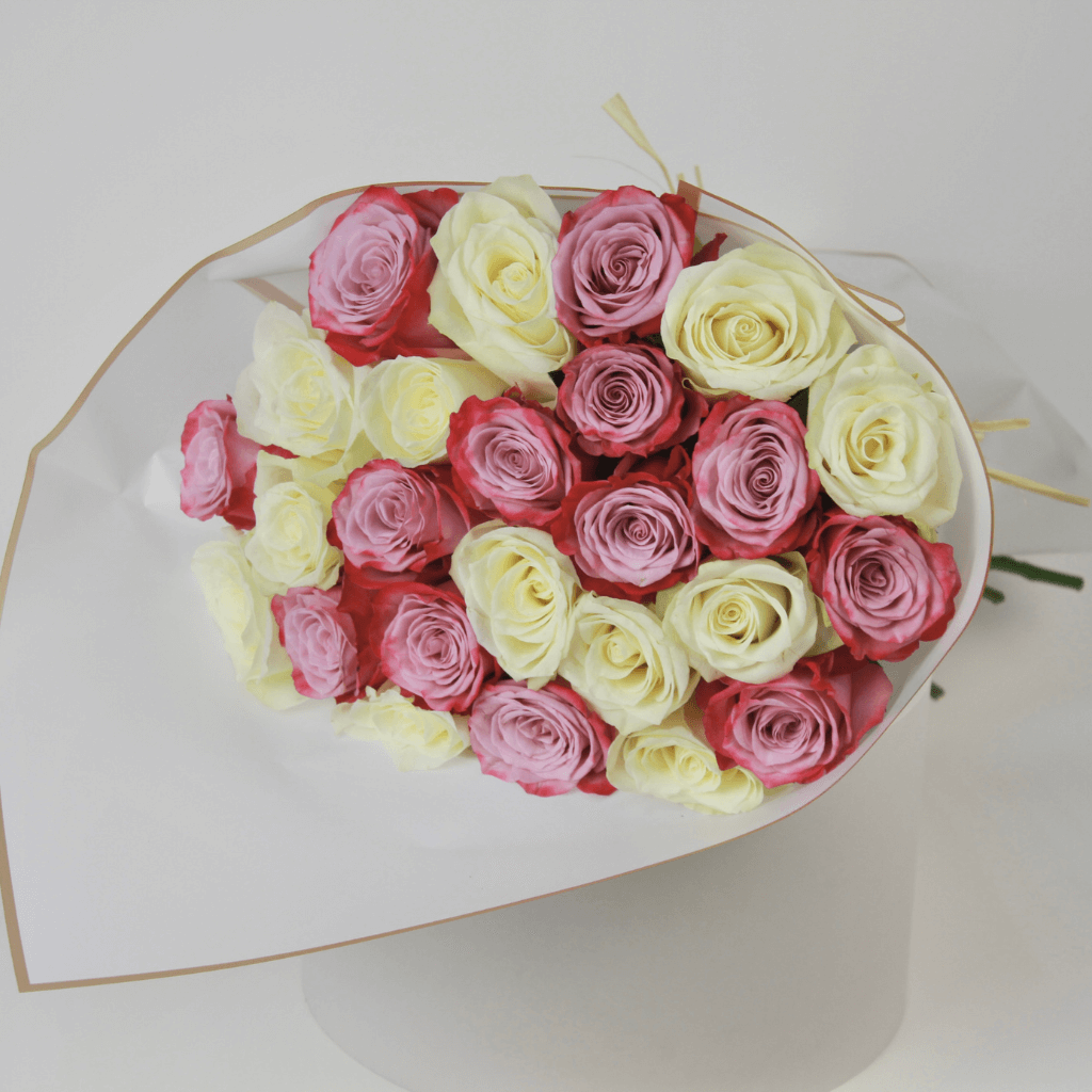 White and purple rose bouquet arranged in soft wrapping for elegant flower delivery in Kuwait