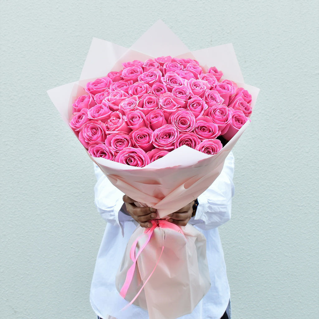 Pink Roses Hand tied Bouquet with white wrapping