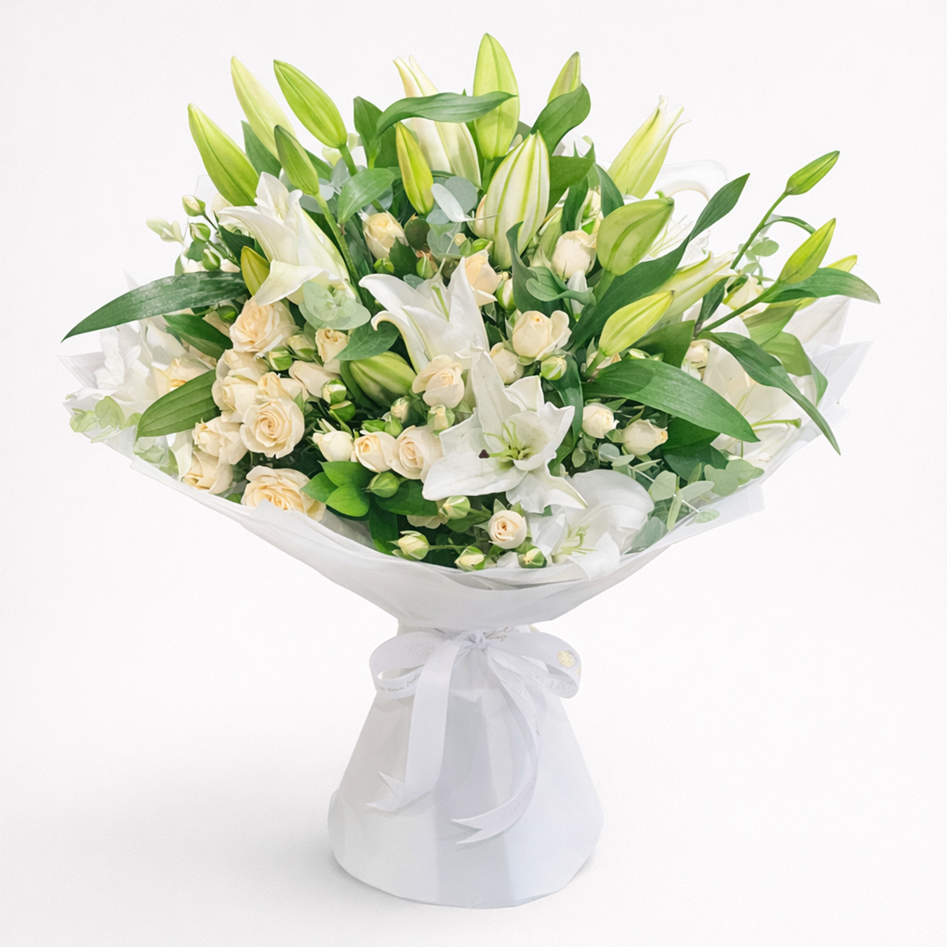 Elegant white lilies and cream roses bouquet by Buy Flower Box in Kuwait