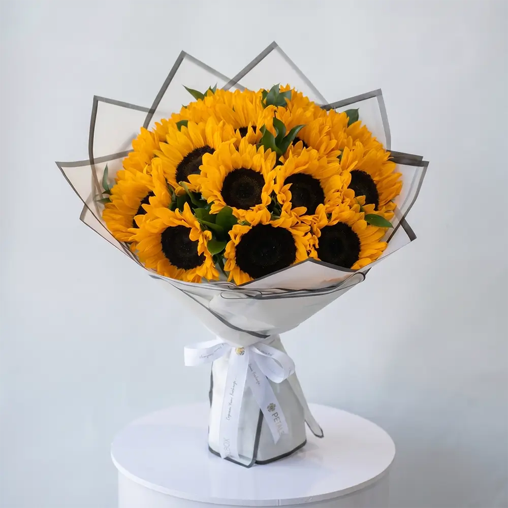 Golden Sunflower Bouquet with fresh yellow sunflowers wrapped in white paper for flower delivery Kuwait by Buy Flower Box.