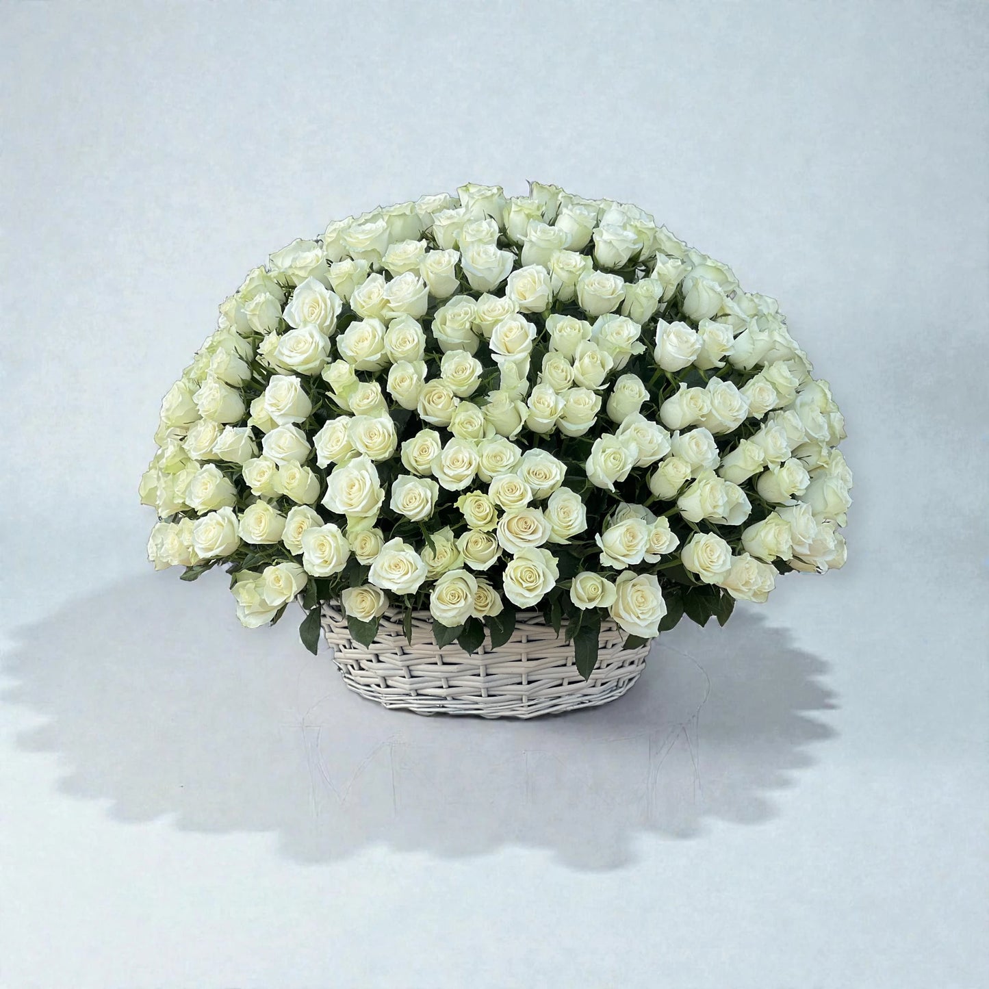 Large white rose flower basket arrangement for flower delivery in Kuwait
