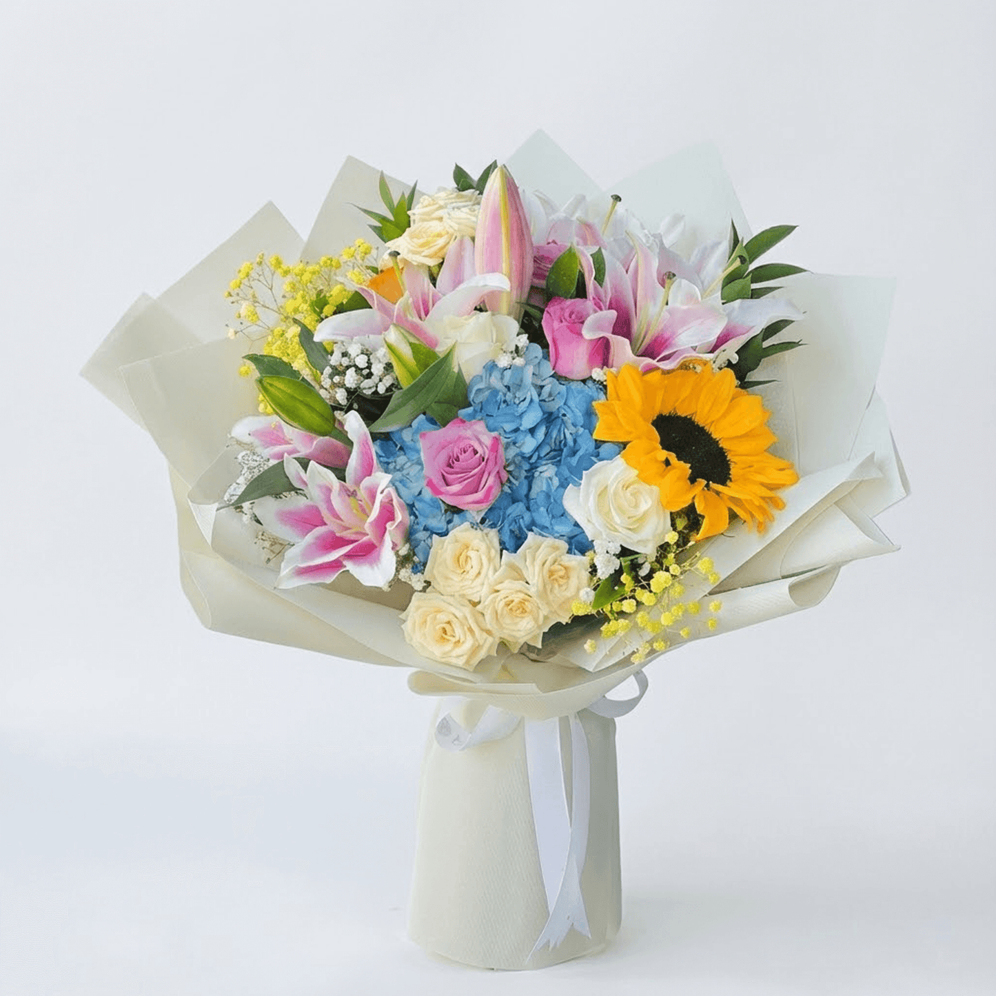 Luxury mixed flower hand-tied bouquet with roses, lilies, hydrangea, and sunflower for flower delivery in Kuwait