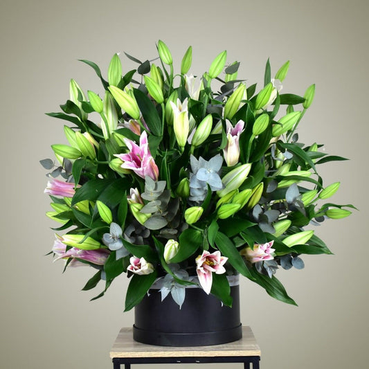 Luxury pink lily flower hatbox arrangement for delivery in Kuwait