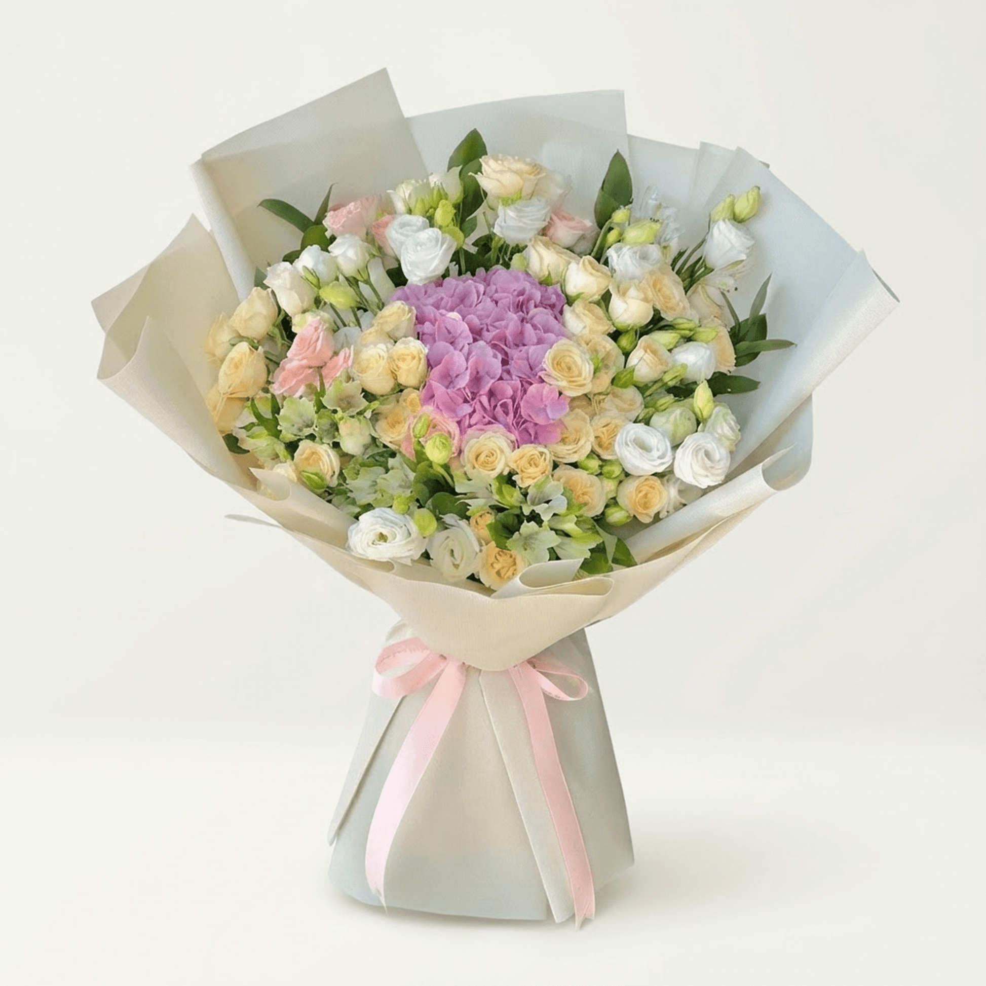 Pastel flower bouquet with pink hydrangea, spray roses, and lisianthus for flower delivery in Kuwait