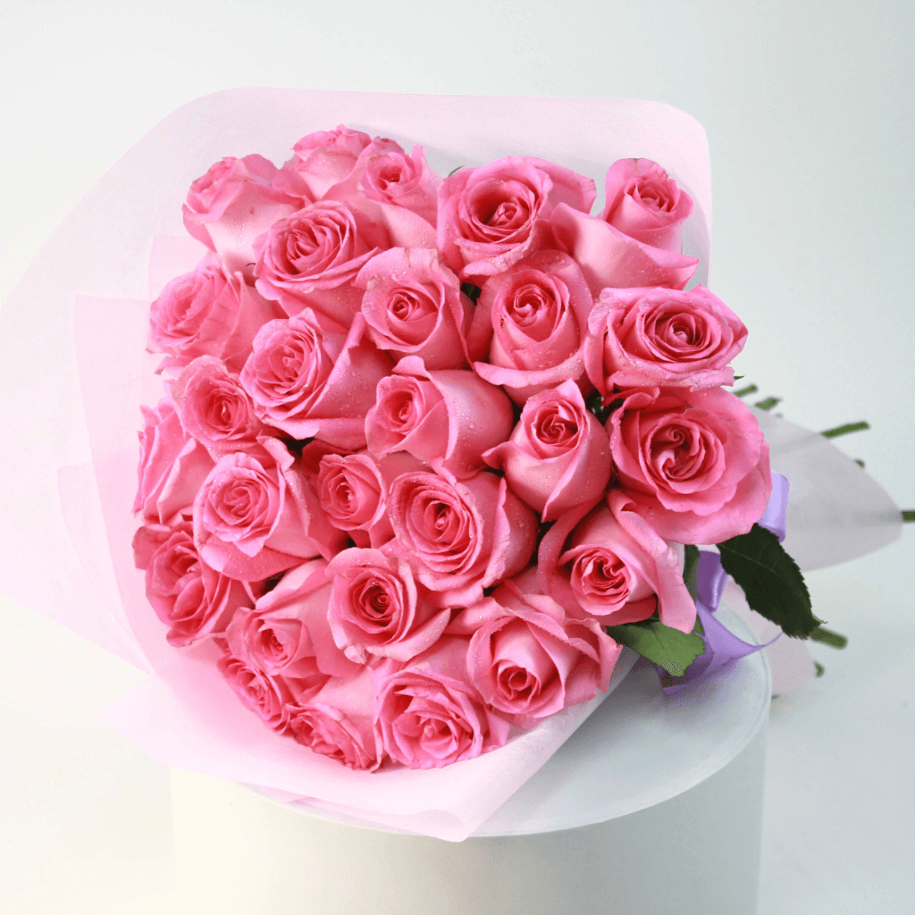 Elegant pink rose bouquet with fresh roses wrapped in soft pastel paper