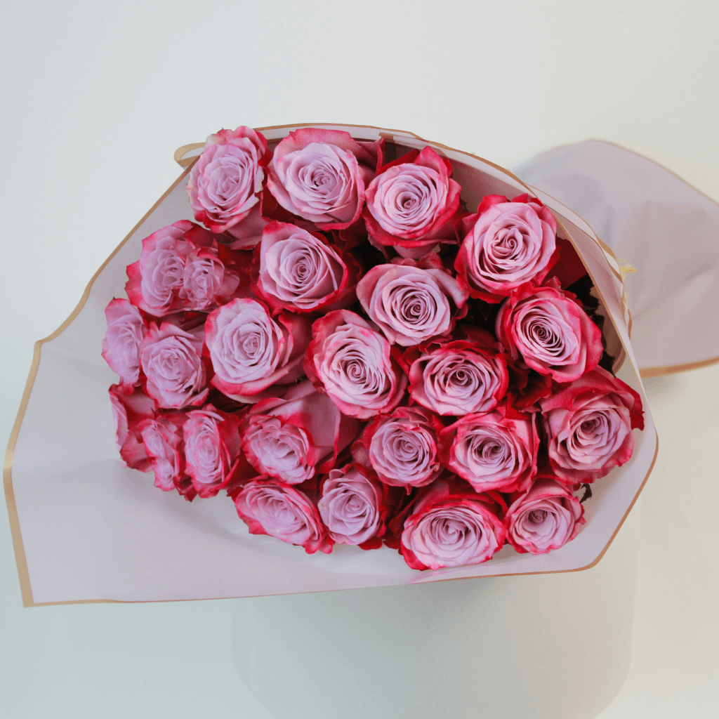 Purple rose bouquet wrapped elegantly, ideal for flower delivery in Kuwait