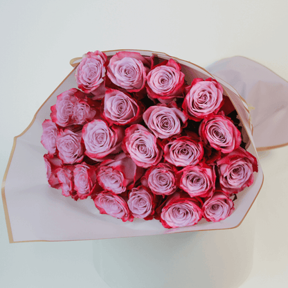Purple rose bouquet wrapped elegantly, ideal for flower delivery in Kuwait