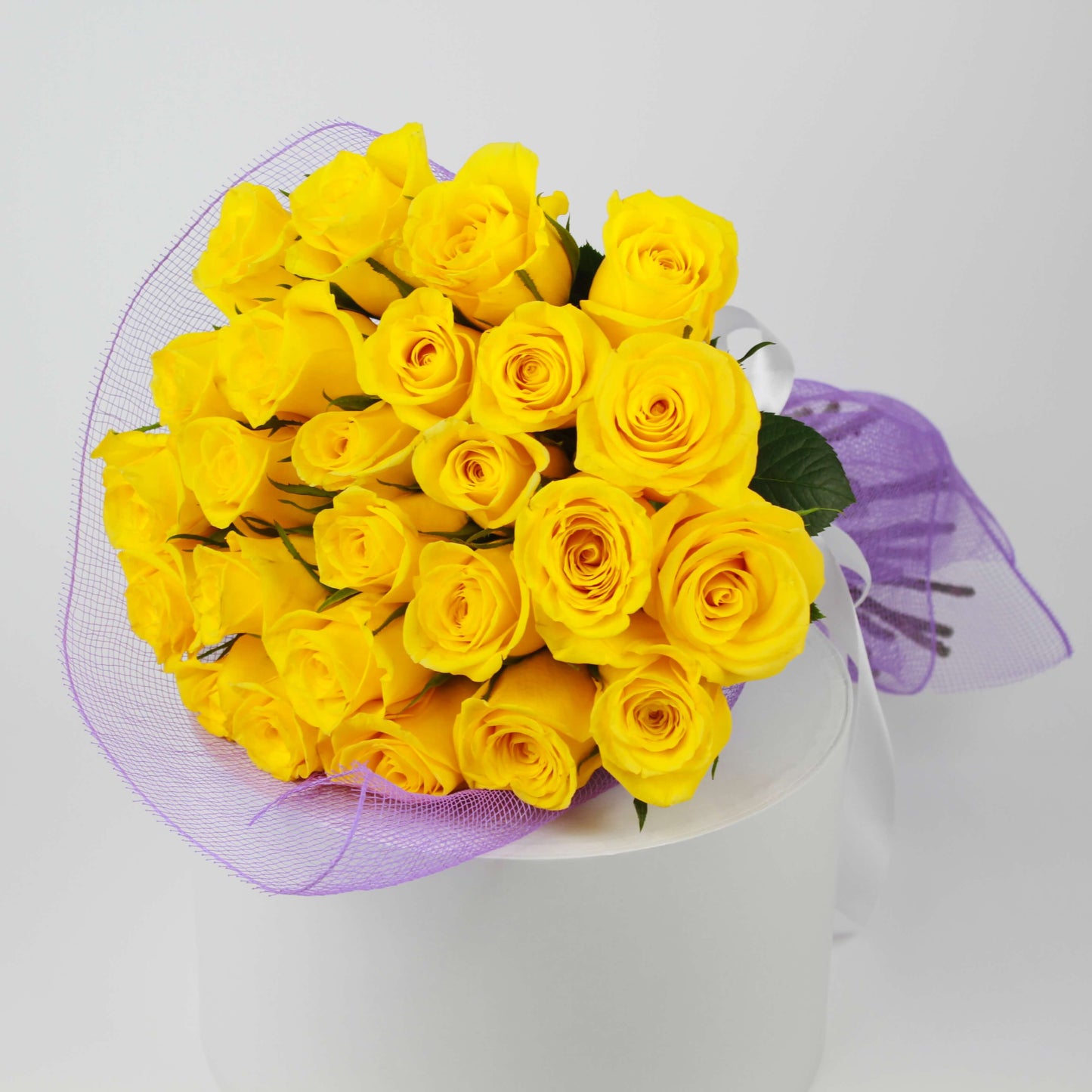 Sunny yellow roses arrangement prepared for flower delivery in Kuwait
