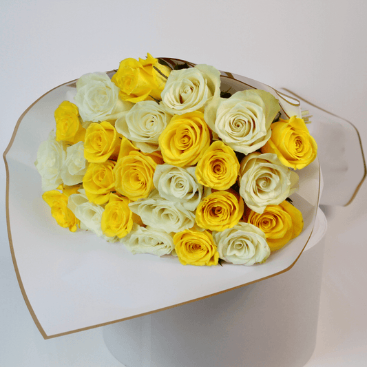 White and yellow rose flower bouquet with fresh roses arranged in elegant wrapping for flower delivery in Kuwait